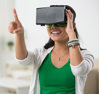 woman playing game in virtual reality glasses
